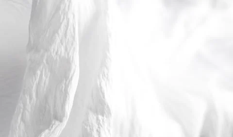 Minimalist white fabric texture with subtle soft lighting Stock Photos