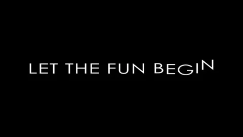Minimalist white typography let the fun begin text on black background Video stock 342753038