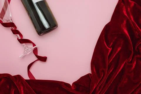 Minimalist Wine and Red Fabric Creative Scene on a Pink Background Stock Photos