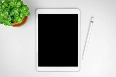Minimalist workspace concept background with tablet mockup and stylus pen on  Stock Photos
