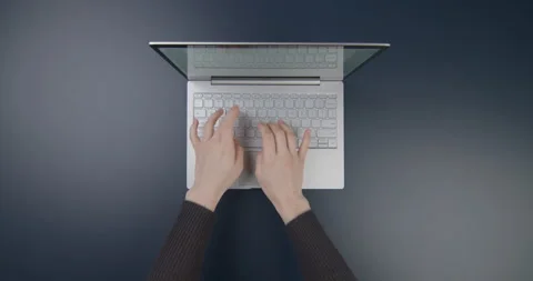 Minimalist workspace with laptop, tablet and woman typing on keyboard, top view. Stock Footage 154692007