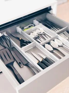 A minimalistic and practical kitchen drawer organizer Stock Photos