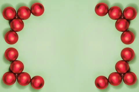 Minimalistic Christmas frame composition with red berries and ribbon on pastel 写真素材