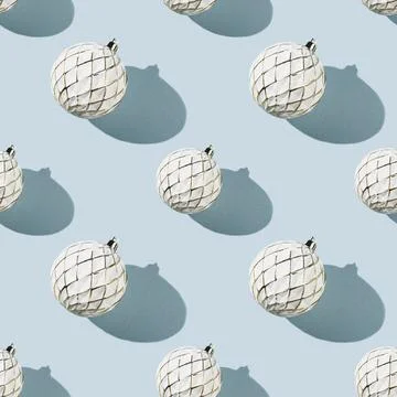 Minimalistic Christmas seamless pattern with white Christmas ball on blue Stock Photos