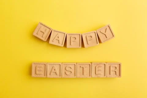 Minimalistic creative Easter concept. Wooden letters Happy Easter Stock Photos