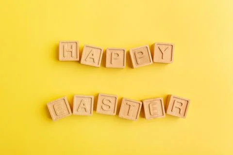 Minimalistic creative Easter concept. Wooden letters Happy Easter Stock Photos