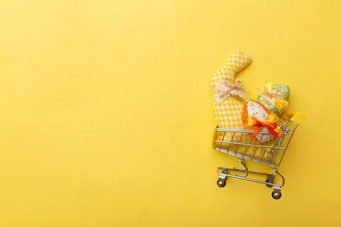 Minimalistic creative Easter concept on the yellow background. Happy Easter Stock Photos