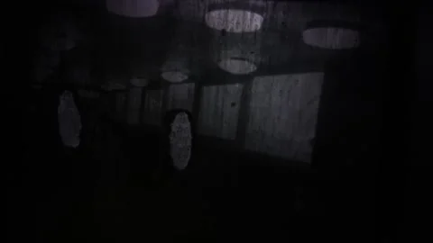 A minimalistic dark frame with a faint line of light breaking through the blackn Stock Footage 293564358