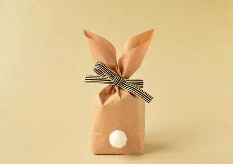 Minimalistic Easter background with a cute paper bunny Stock Photos