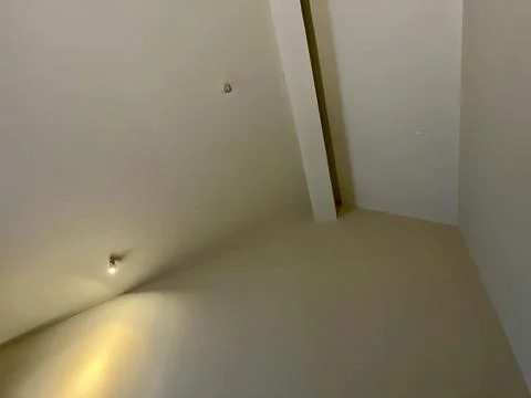 Minimalistic empty room corner with clean white interior walls 写真素材