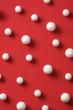 Minimalistic pattern with white spheres on a red background Stock Photos