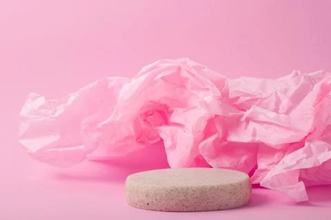 Minimalistic scene of a lying stone on a light pink abstract background. Foto stock