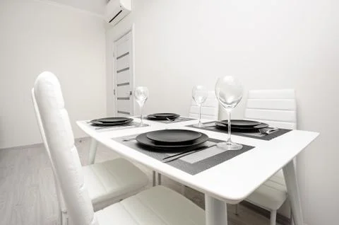 Minimalistic served white table Stock Photos
