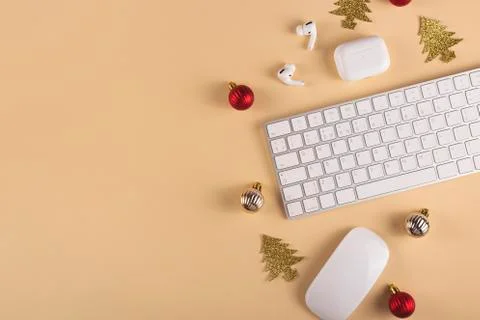 Minimalistic Stylish computer workplace among Christmas decorations Stock Photos