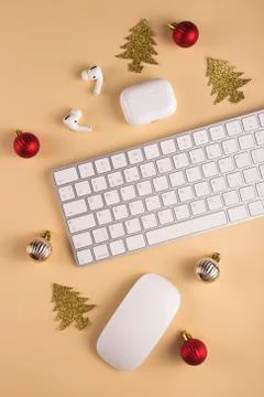 Minimalistic Stylish computer workplace among Christmas decorations Stock Photos