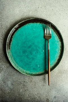 Minimalistic table setting with plate and cutlery Stock Photos