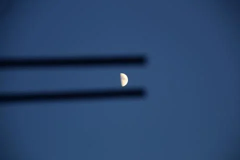 A minimalistic view of a half moon. 스톡 사진