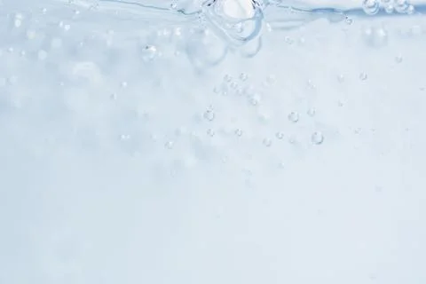 Minimalistic water background with bubbles. Stock Photos