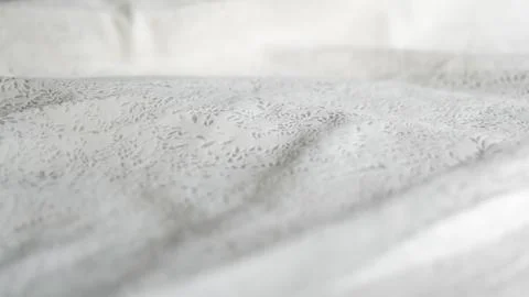 Minimalistic white crumpled fabric with pattern Stock Photos