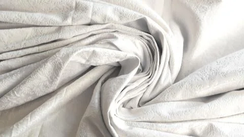 Minimalistic white crumpled fabric with pattern Stock Photos