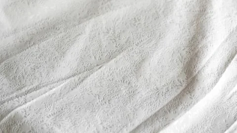 Minimalistic white crumpled fabric with pattern Stock Photos