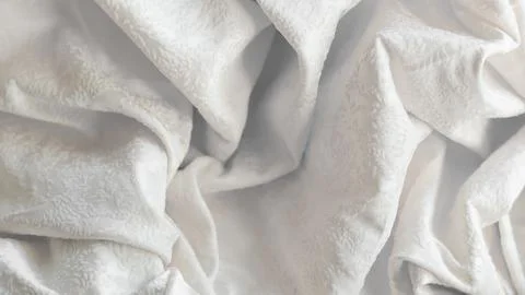 Minimalistic white crumpled fabric with pattern Stock Photos