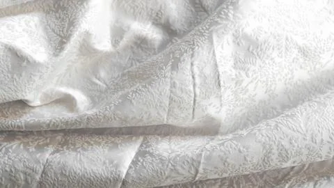 Minimalistic white crumpled fabric with pattern Foto stock