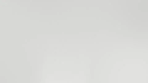 Minimalistic off-white seamless loop background in 4K. Subtle texture creates a Vídeo Stock 309058606