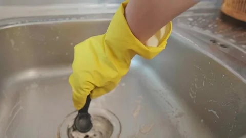 Minimum effort, maximum result. Cleaning products help easily tackle kitchen mes Stock Footage 301869224