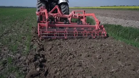 Minimum tillage and soil  harrowing. Travelling shot Stock Footage 113296231