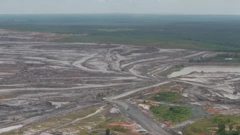 Mining activities on mining roads, dump trucks passing by carrying goods Stock Footage 332601689