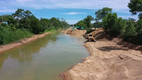 Mining beside river Stock Footage 132331473