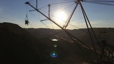 Mining boom. Excavator loads ore.Panorama. Artificial lake. Sunset. Development Stock Footage 73442288