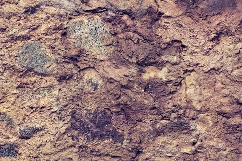 Mining cliff rough surface. Heavy grunge damage natural wall background. Stock Photos