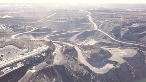 Mining coal at a coal mine without height on passing large trucks excavators Stock Footage 161546540
