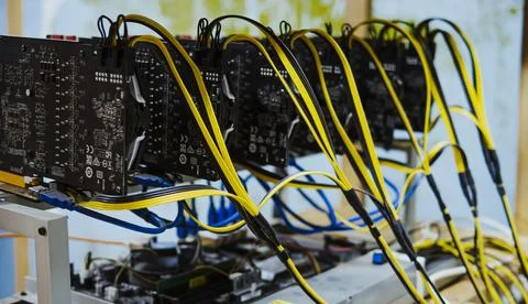 Mining crypto currency. Close-up a graphic card of computer working for mining Stock Photos