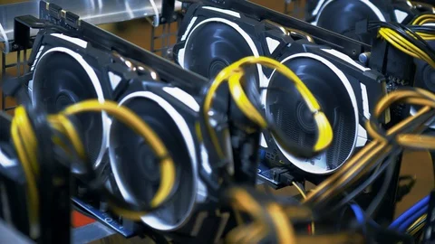 Mining of cryptocurrency in bitcoin mining farm. Fans on video cards close-up  Stock Footage 122011535