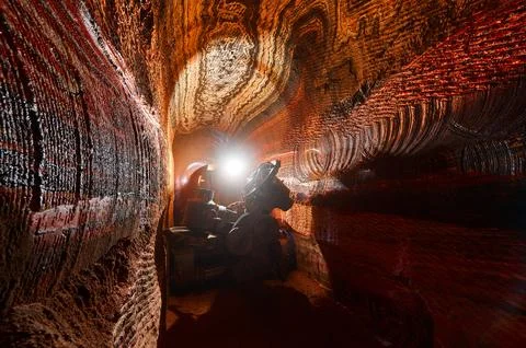 Mining drilling machine in tunnel of sylvinite salt quarry Stock Photos