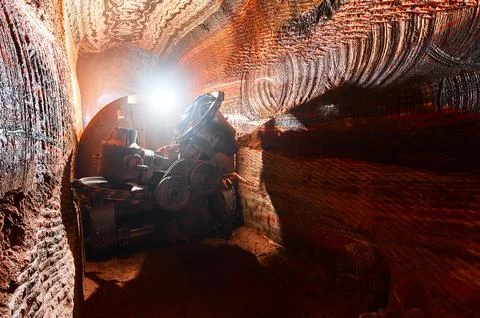 Mining drilling machine in tunnel of sylvinite salt quarry Stock Photos