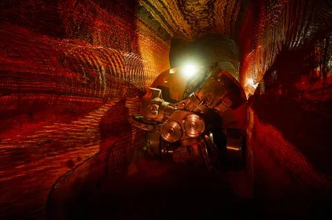 Mining drilling machine in tunnel of sylvinite salt quarry Stock Photos