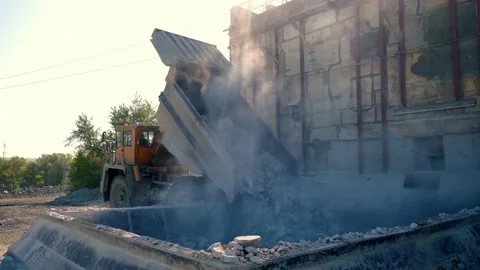 The mining dump truck dumps the stone into the bunker. Overall plan Stock Footage 212365339