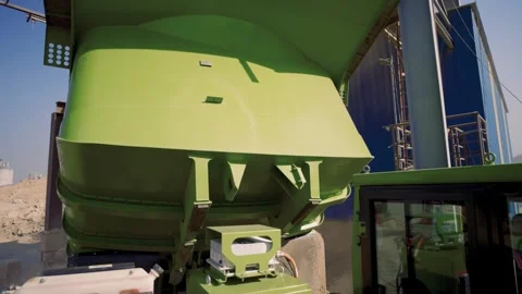 Mining dump truck swivel hopper check. Green NHL TR50E EV inspection on clear 스톡 동영상 332519738