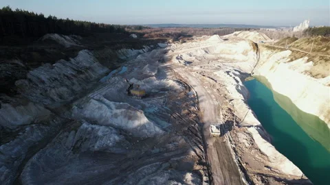 Mining dump truck transporting chalk rock from an open pit. Video stock 186501530