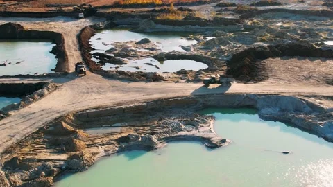 Mining dump truck unloading. Heavy transport in mining industry. Stock Footage 191923963