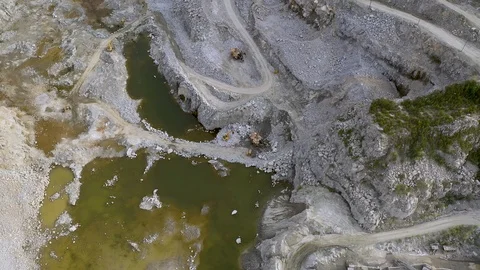 Mining dump trucks in open pit mine. Loaded truck rides on the road quarry. The Stock Footage 113552035