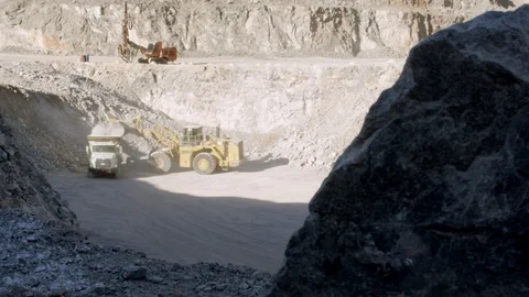 Mining Dump Trucks Working in a mine Stock Footage 98761423