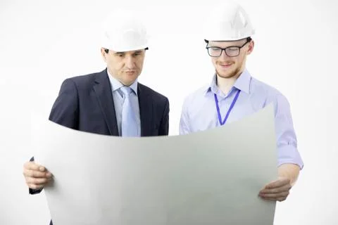 Mining engineer and architect working, measuring layout of building blueprint Stock Photos