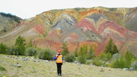 Mining engineer, a geologist in the protective reflective vest, gloves and Stock Footage 79458212