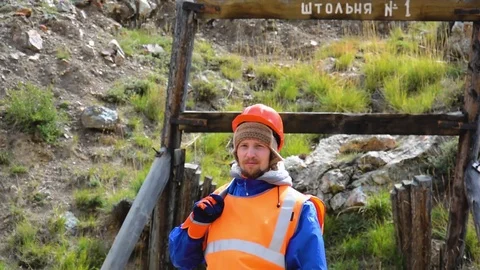 Mining engineer, a geologist in the protective reflective vest, gloves and Stock Footage 81482962