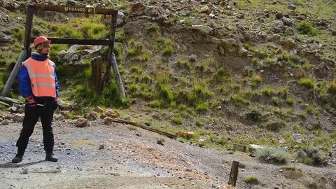 Mining engineer, a geologist in the protective reflective vest, gloves and Stock Footage 81483625